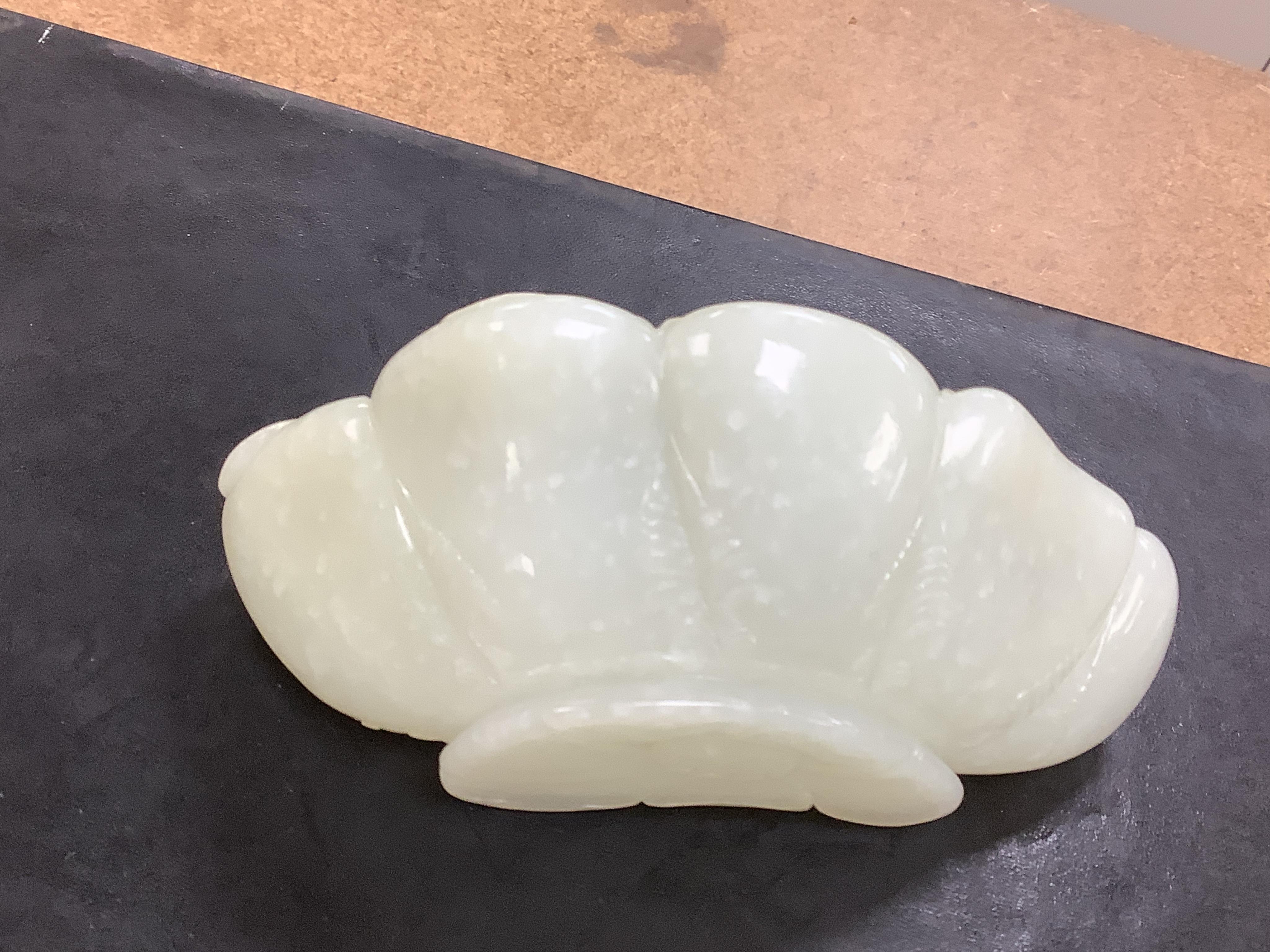 A Chinese jade ‘lotus’ shaped brush washer, 13cm wide. Condition - good